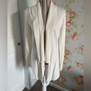 Very stylish cream cardigan with gold button accents